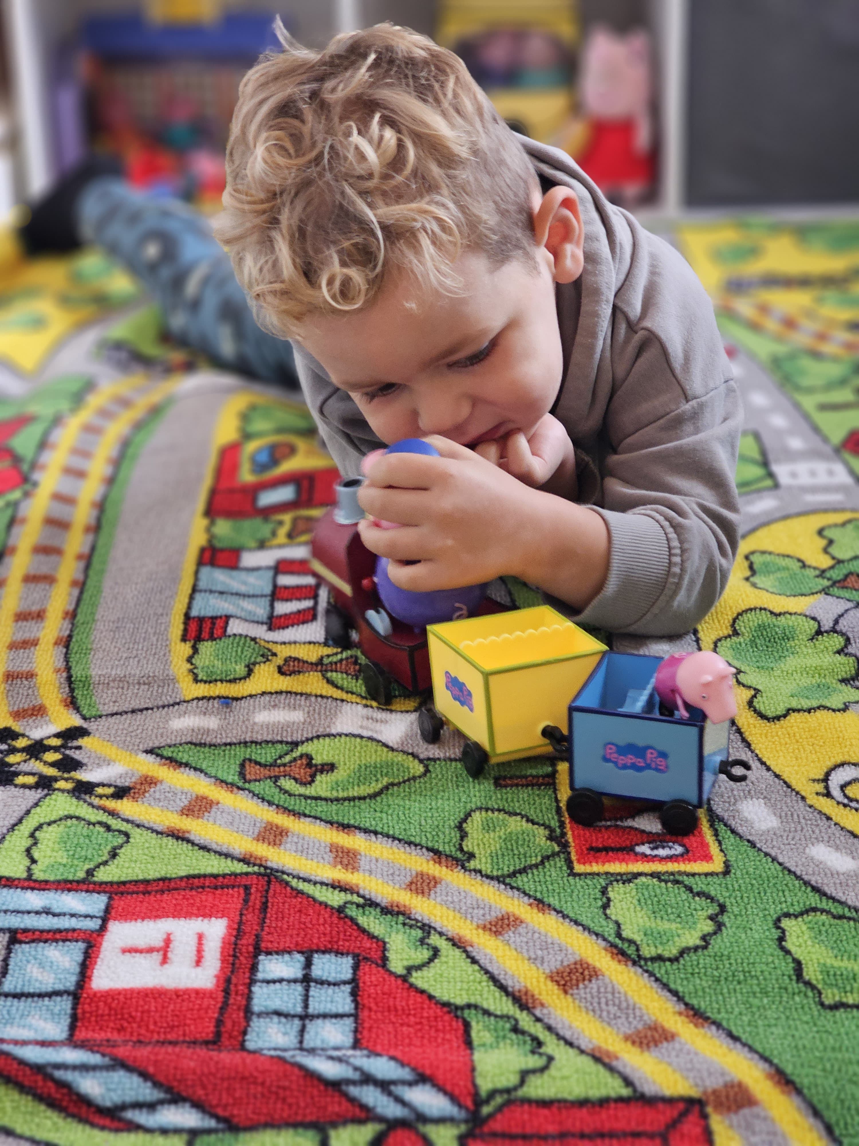 Toddler crawling on soft kids rugs